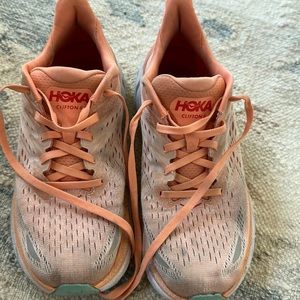 clifton 8 hokas! orange with red lettering and teal on the bottom